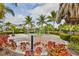 playground with modern equipment surrounded by tropical plants at 379 Aruba Cir # 202, Bradenton, FL 34209