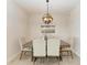 Bright dining room featuring a wood table and six chairs at 379 Aruba Cir # 202, Bradenton, FL 34209