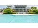 Community pool with clubhouse backdrop at 379 Aruba Cir # 202, Bradenton, FL 34209