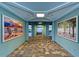 Building interior with elevator and artwork at 379 Aruba Cir # 202, Bradenton, FL 34209