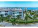 Aerial view of waterfront community with upscale building and lush landscaping at 379 Aruba Cir # 202, Bradenton, FL 34209
