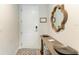 Bright entryway featuring a console table and a stylish mirror at 379 Aruba Cir # 202, Bradenton, FL 34209