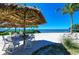 Beachfront seating under a tiki hut at 379 Aruba Cir # 202, Bradenton, FL 34209