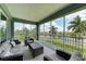 Relaxing screened balcony overlooking the lake and community at 379 Aruba Cir # 202, Bradenton, FL 34209