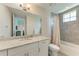 Bathroom boasts granite countertop, white cabinets, and shower/tub at 379 Aruba Cir # 202, Bradenton, FL 34209