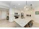 Spacious kitchen with large island, white cabinets, and granite countertops at 379 Aruba Cir # 202, Bradenton, FL 34209