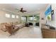 Bright living room with sectional sofa and sliding doors to balcony at 379 Aruba Cir # 202, Bradenton, FL 34209