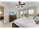 Bright main bedroom with water views and a dresser at 379 Aruba Cir # 202, Bradenton, FL 34209