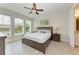 Spacious main bedroom with large windows and a comfortable king-size bed at 379 Aruba Cir # 202, Bradenton, FL 34209