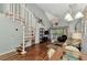 Bright living room boasts hardwood floors, vaulted ceilings, and a spiral staircase at 6800 Placida Rd # 281, Englewood, FL 34224