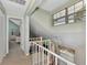 Upstairs loft area with a spiral staircase and views of the home at 6800 Placida Rd # 281, Englewood, FL 34224