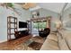 Spacious living room with hardwood floors, vaulted ceilings, and sliding glass doors at 6800 Placida Rd # 281, Englewood, FL 34224