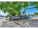 Outdoor patio area with seating under a large tree, next to the Blue Paradise restaurant at 6800 Placida Rd # 281, Englewood, FL 34224