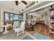 Screened lanai with tiled flooring, outdoor seating and view of lush landscaping at 6800 Placida Rd # 281, Englewood, FL 34224