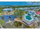 Aerial view of community with pool, tennis courts, and pond at 6800 Placida Rd # 281, Englewood, FL 34224