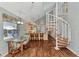 Bright dining area with spiral staircase and kitchen access at 6800 Placida Rd # 281, Englewood, FL 34224