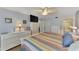 Main bedroom with large bed, dresser and access to bathroom at 6800 Placida Rd # 281, Englewood, FL 34224