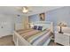 King-size bed in bright bedroom with ensuite access at 6800 Placida Rd # 281, Englewood, FL 34224
