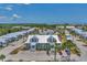 Aerial view of a condo community with a pool and tennis courts at 6800 Placida Rd # 281, Englewood, FL 34224