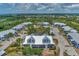 Aerial view showcasing a condo building with surrounding landscape at 6800 Placida Rd # 281, Englewood, FL 34224