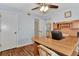 Bright home office with built-in wood desk and laminate flooring at 6800 Placida Rd # 281, Englewood, FL 34224