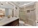 Updated bathroom with a walk-in shower and a modern vanity at 6800 Placida Rd # 281, Englewood, FL 34224