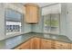 Well-equipped kitchen featuring wood cabinets, granite countertops, and stainless steel appliances at 6800 Placida Rd # 281, Englewood, FL 34224