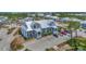 Building exterior, featuring metal roof and parking at 6800 Placida Rd # 281, Englewood, FL 34224