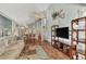 Spacious living area with hardwood floors, vaulted ceilings, and access to balcony at 6800 Placida Rd # 281, Englewood, FL 34224