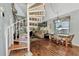 Living room with spiral staircase and wood flooring at 6800 Placida Rd # 281, Englewood, FL 34224