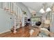 Open living room with spiral staircase and high ceilings at 6800 Placida Rd # 281, Englewood, FL 34224