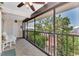 Relaxing screened balcony overlooking a courtyard and tennis court at 6800 Placida Rd # 281, Englewood, FL 34224