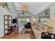 Living room with hardwood floors, vaulted ceiling, and comfortable seating at 6800 Placida Rd # 281, Englewood, FL 34224