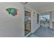Condo entryway with tiled floor and beachy decor at 6800 Placida Rd # 281, Englewood, FL 34224