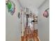 Hallway with spiral staircase and hardwood floors at 6800 Placida Rd # 281, Englewood, FL 34224