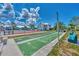 Outdoor shuffleboard court with benches and surrounding buildings at 6800 Placida Rd # 281, Englewood, FL 34224