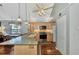 Open kitchen with island, stainless steel appliances, and access to hallway at 6800 Placida Rd # 281, Englewood, FL 34224