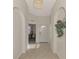 Bright and airy entryway with tile flooring and access to other rooms at 4429 Corso Venetia Blvd # C19, Venice, FL 34293