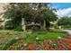 Attractive community entrance with lush landscaping and signage at 409 N Point Rd # 501, Osprey, FL 34229