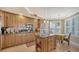 Modern kitchen featuring granite countertops and updated wood cabinetry at 409 N Point Rd # 501, Osprey, FL 34229