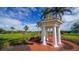 White gazebo with brick pathway on the golf course at 409 N Point Rd # 501, Osprey, FL 34229