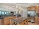 Open kitchen with granite countertops, stainless steel appliances, and an island at 409 N Point Rd # 501, Osprey, FL 34229