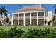 Two-story clubhouse featuring columns and balconies at 409 N Point Rd # 501, Osprey, FL 34229