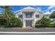 Main entrance to the clubhouse with columns and balcony at 409 N Point Rd # 501, Osprey, FL 34229