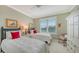Guest bedroom with twin beds, plantation shutters, and ample closet space at 409 N Point Rd # 501, Osprey, FL 34229