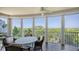 Relaxing screened balcony boasting scenic nature views and outdoor seating at 409 N Point Rd # 501, Osprey, FL 34229