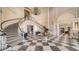 Grand lobby featuring a double staircase and chandelier at 409 N Point Rd # 501, Osprey, FL 34229