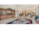 Open living space with hardwood floors, a dining area, and kitchen access at 409 N Point Rd # 501, Osprey, FL 34229