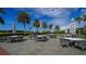 Stone patio with multiple tables and stylish umbrellas at 409 N Point Rd # 501, Osprey, FL 34229