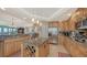 Gourmet kitchen with granite countertops, stainless steel appliances, and ample cabinetry at 409 N Point Rd # 501, Osprey, FL 34229